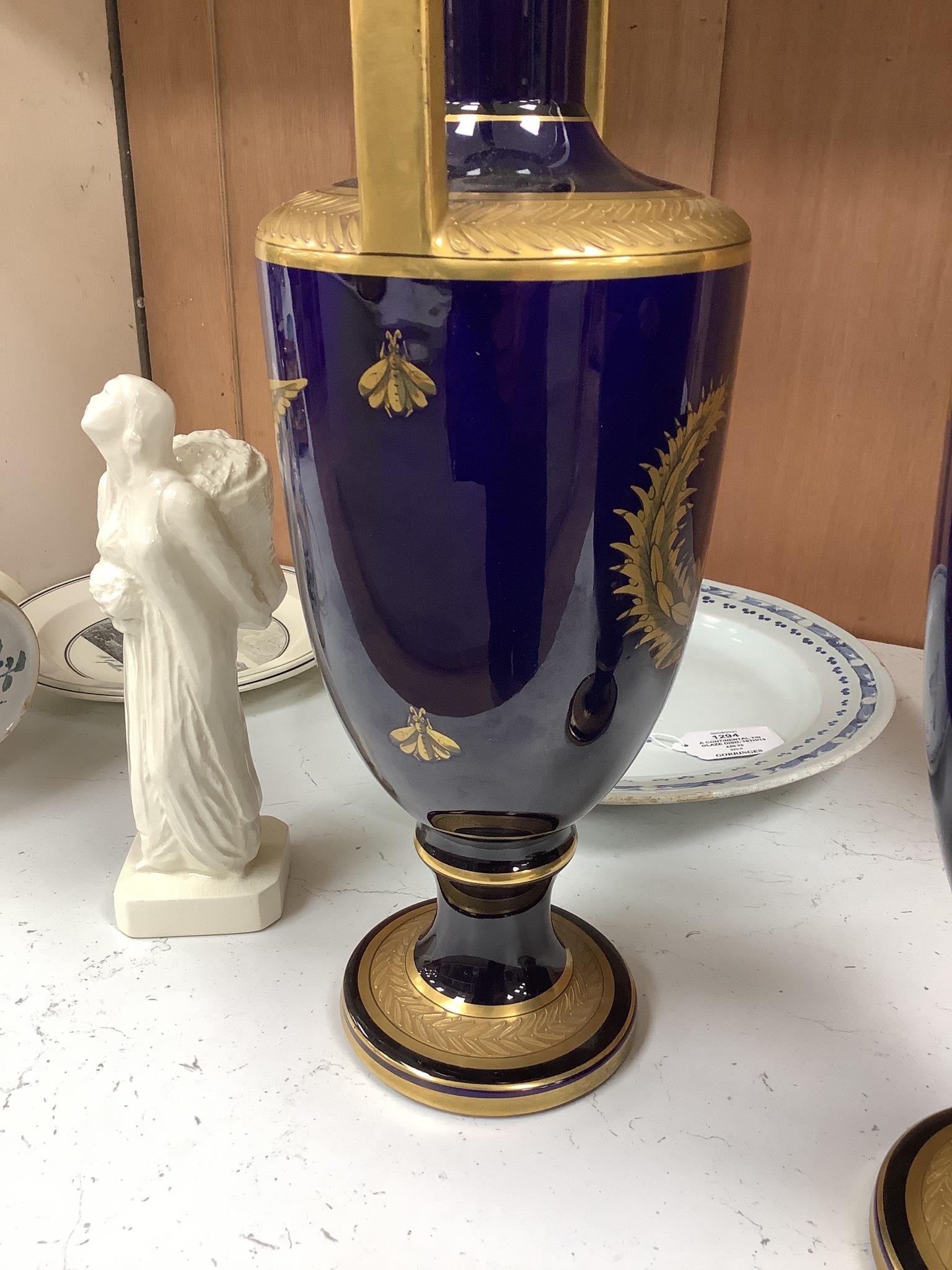A pair of French gilt blue porcelain two handled vases, height 45cm